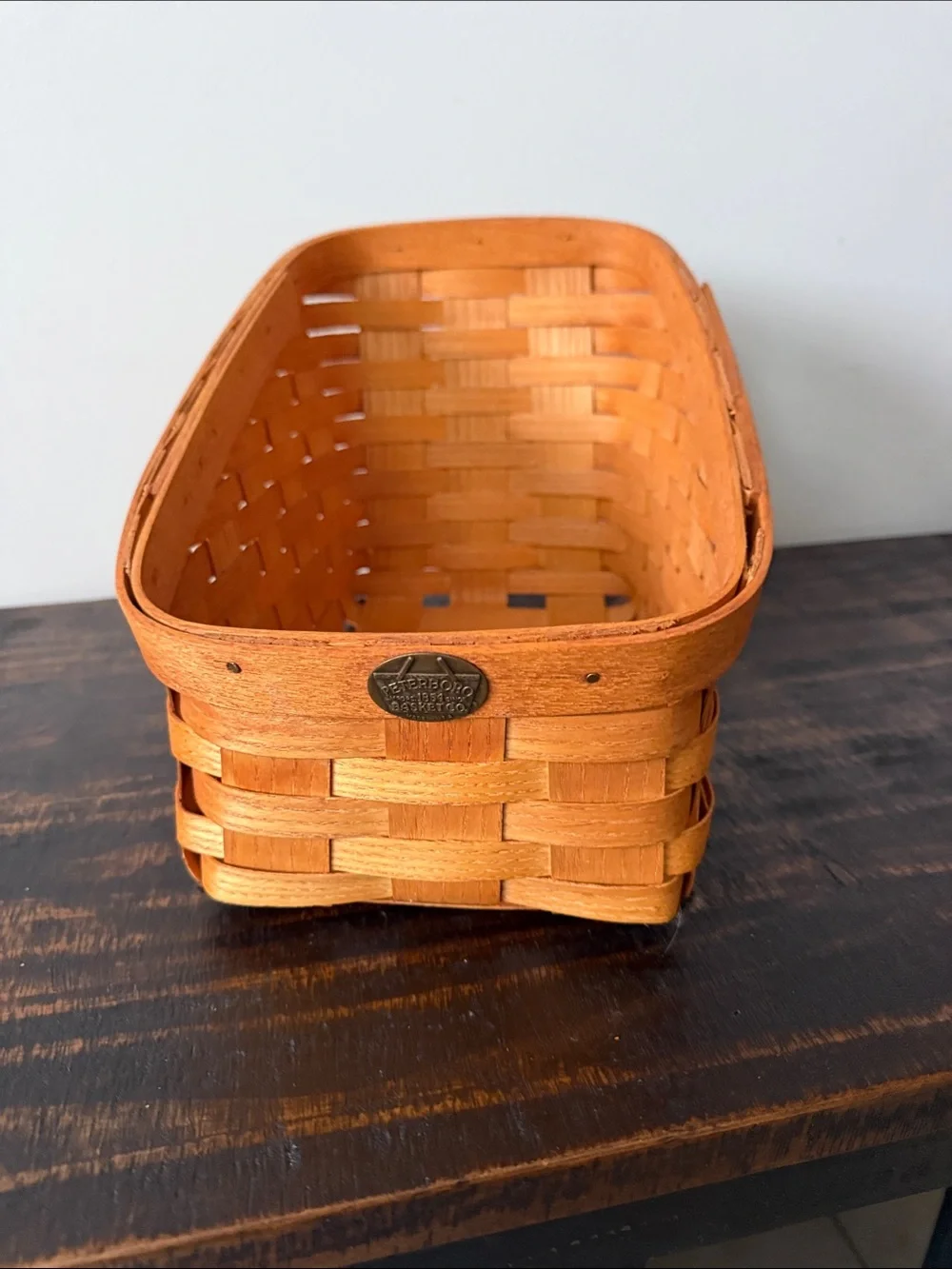 Handwoven Orange Storage Basket with Metal Badge